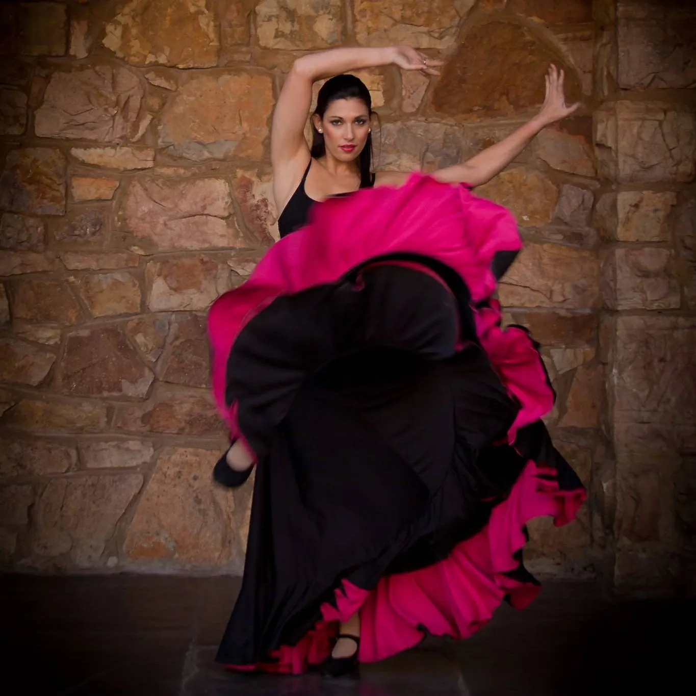 Nadia Katz performing in a black and pink dress